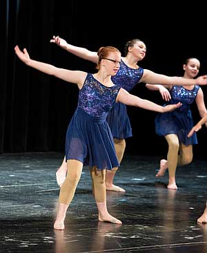 Teenage female modern dancer performing